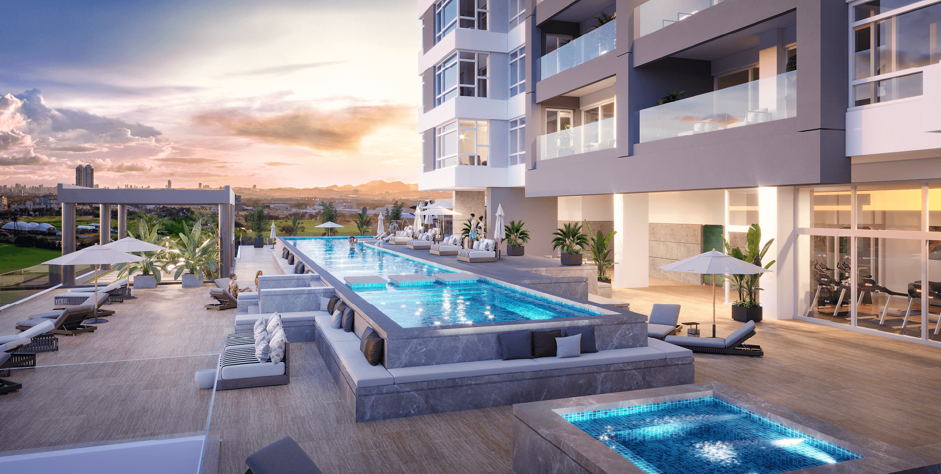 Adult pool and lounge deck at dusk on the Guayacan amenity level