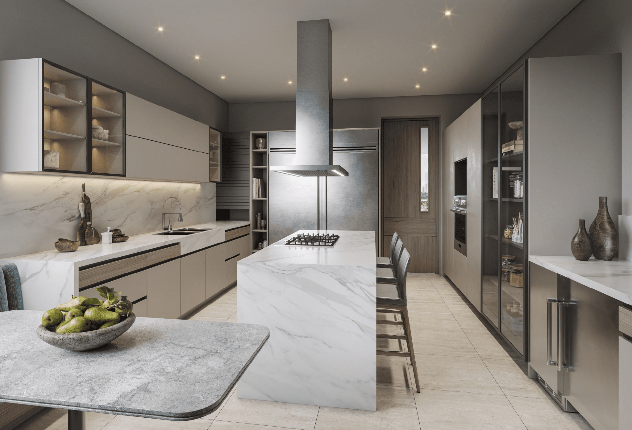 Kitchen with marble island and stainless hood in a Guayacan apartment