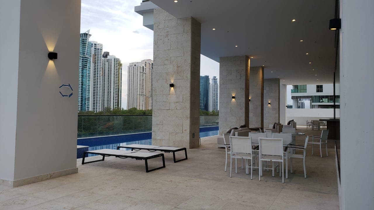 Covered social terrace beside the pool at Parkview Residence