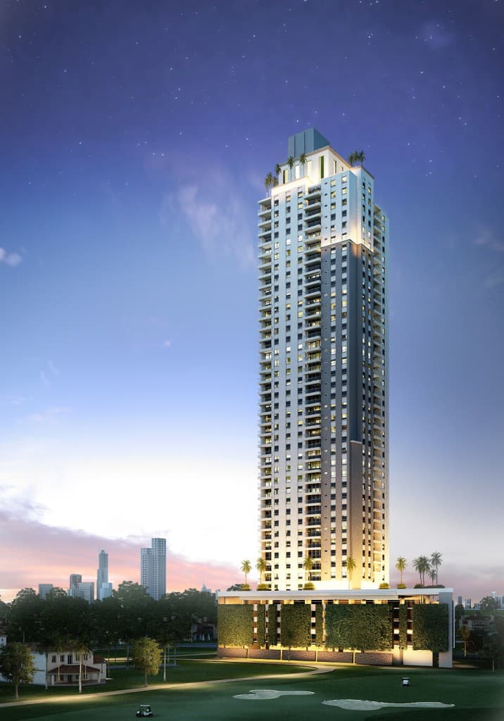 Rendering of the Greenview Residences tower lit at night above the Santa Maria golf course