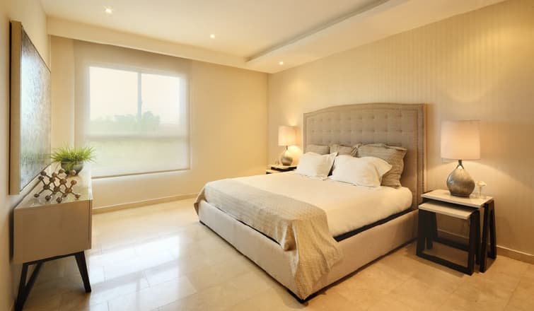 Bedroom with upholstered headboard in a Greenview Residences apartment