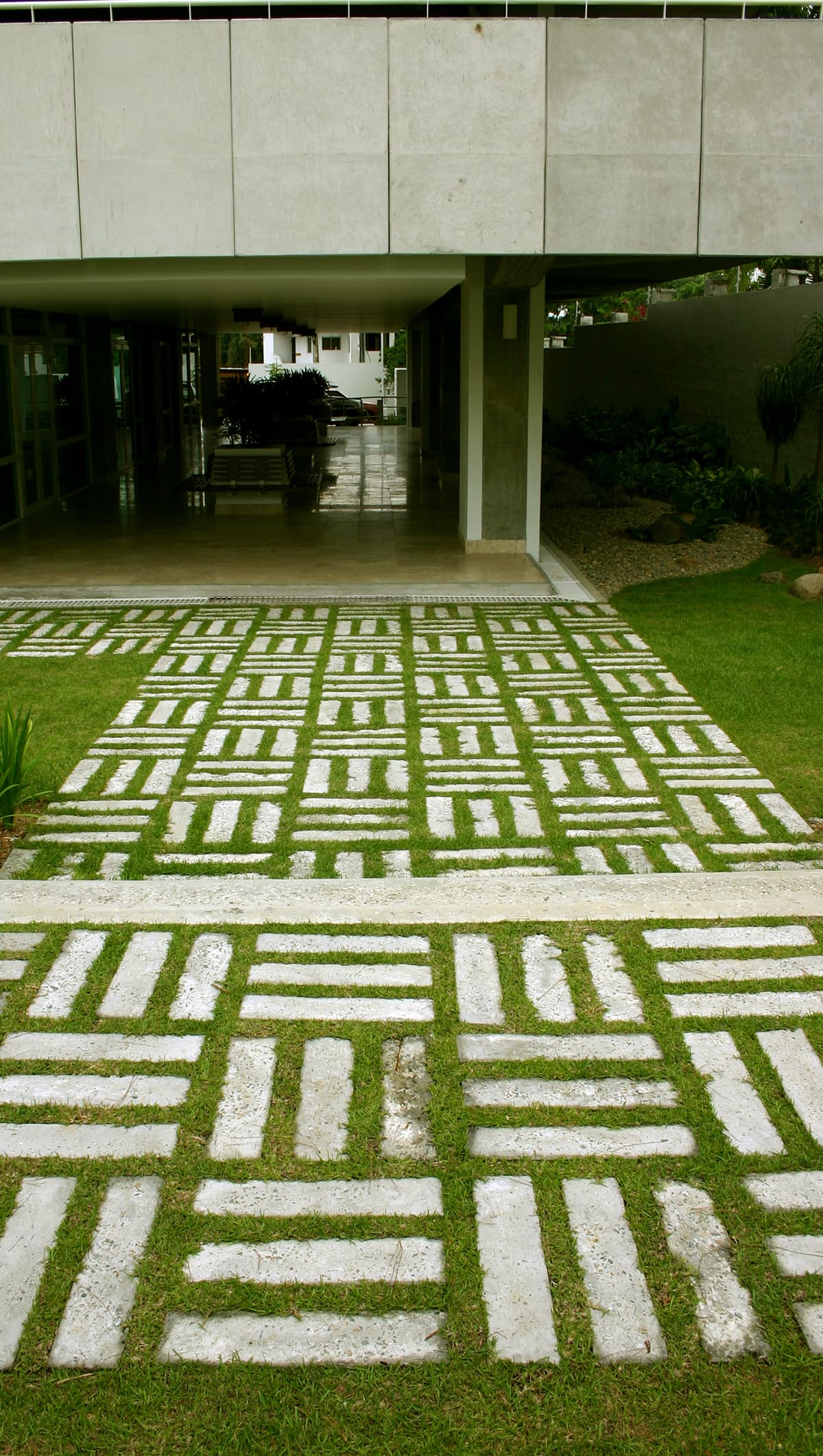 Garden path of stone pavers leading to the PH Pradera lobby