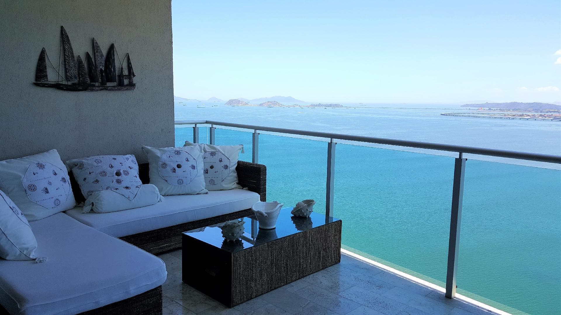 Photograph of a furnished Aquamare balcony lounge over the Bay of Panama
