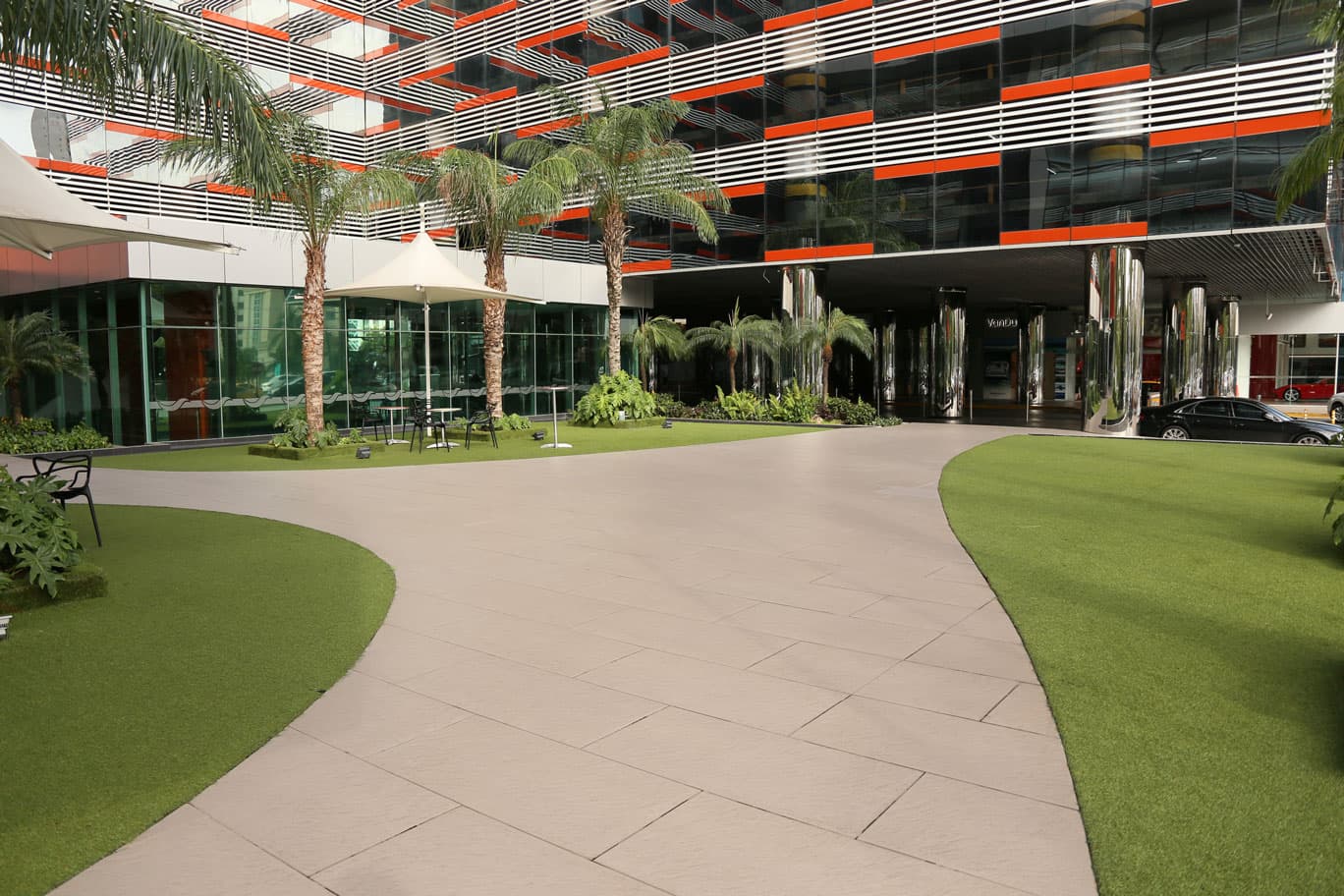 Oceania Business Plaza landscaped entrance plaza with palm trees