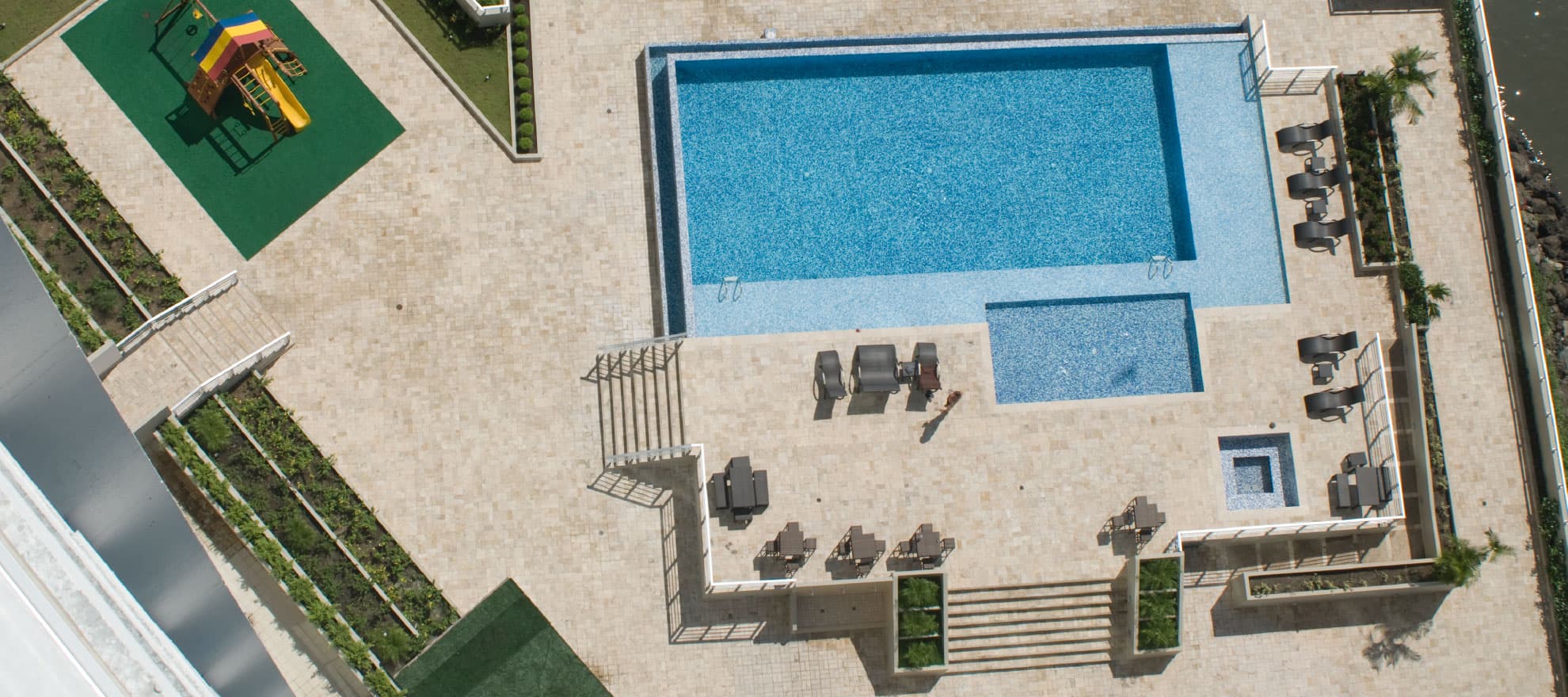 Torres Terrasol aerial view of the pool deck, playground and social area