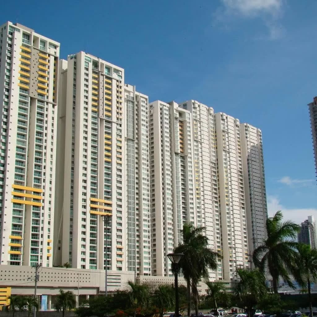 Torres Terrasol white residential towers with yellow balcony accents above their podium on Vía Israel, San Francisco, Panama City
