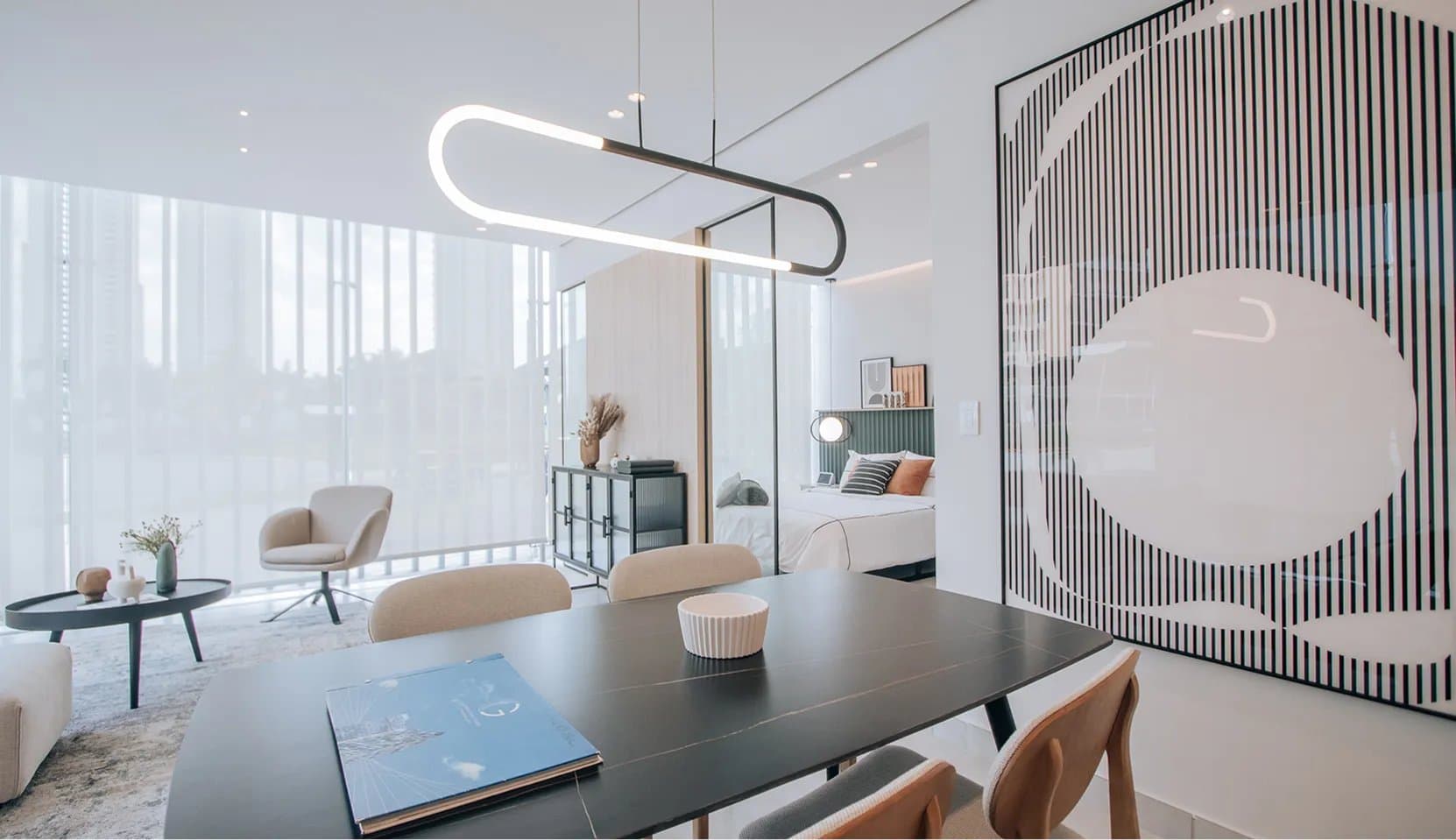 Furnished condo-suite with dining table and bedroom at Generation Tower