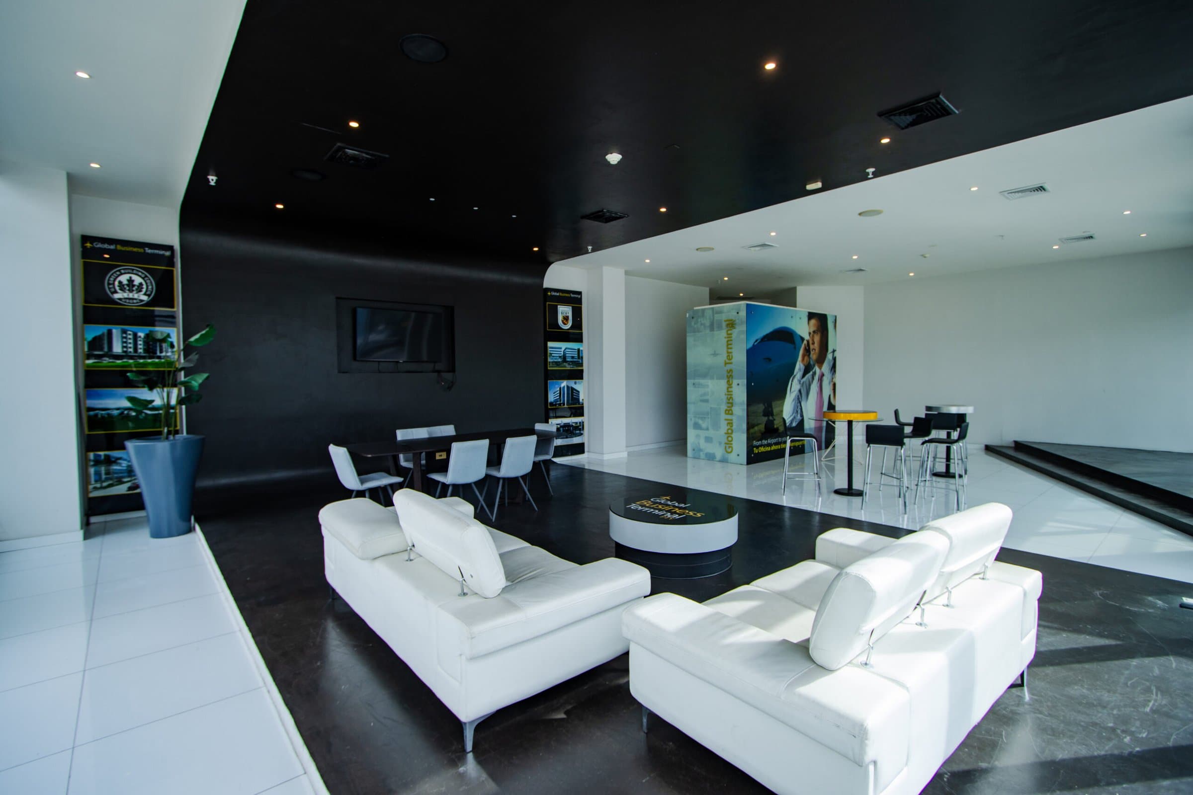 Reception lounge with white sofas at Global Business Terminal