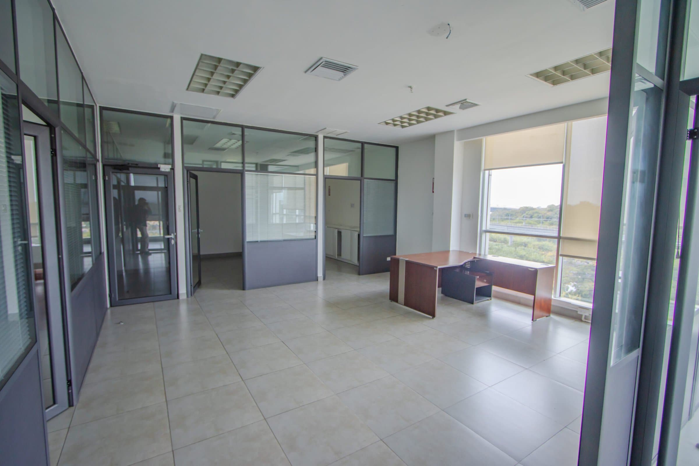 Glass-partitioned private offices at Global Business Terminal