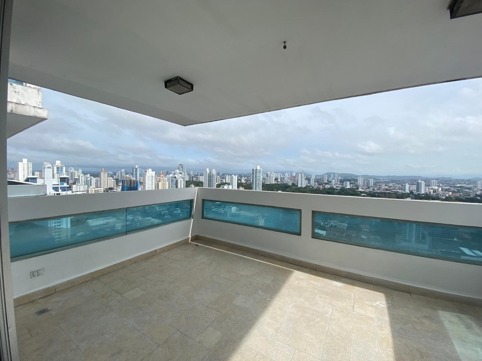 Wide covered balcony overlooking the city skyline at PH The View, San Francisco, Panama City