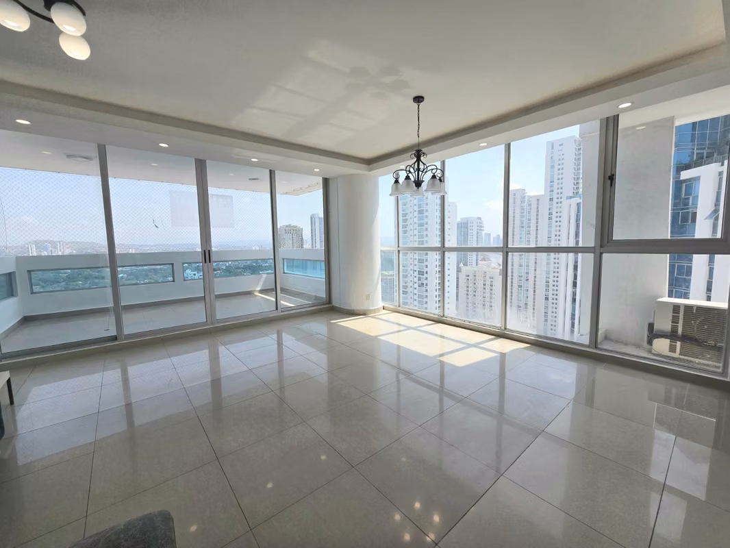 Living and dining area with floor-to-ceiling windows and city views at PH The View, San Francisco, Panama City