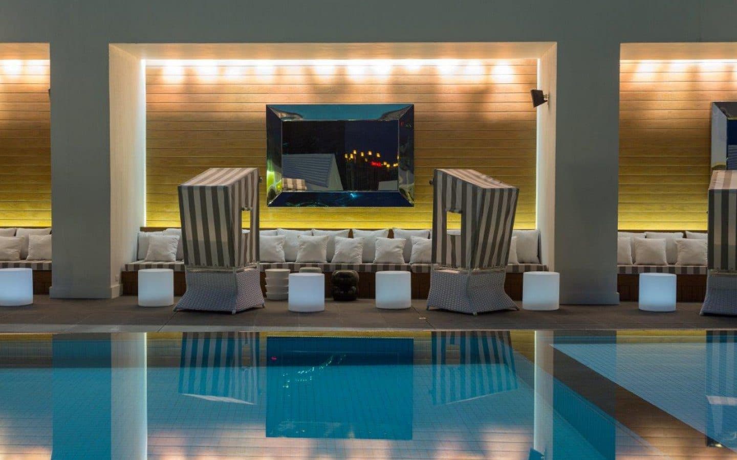 Poolside lounge with illuminated cabanas at Yoo Panama & Arts Tower