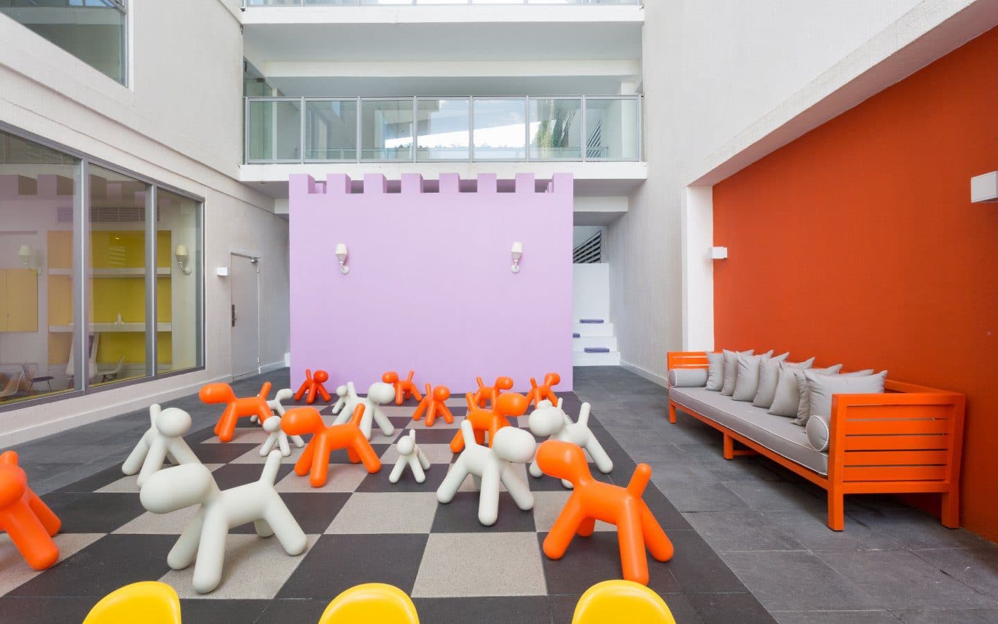 Children's play area with oversized toy dogs at Yoo Panama & Arts Tower