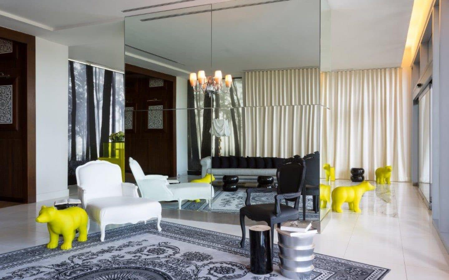 Lobby lounge with Starck-designed furniture and yellow bear sculptures at Yoo Panama & Arts Tower