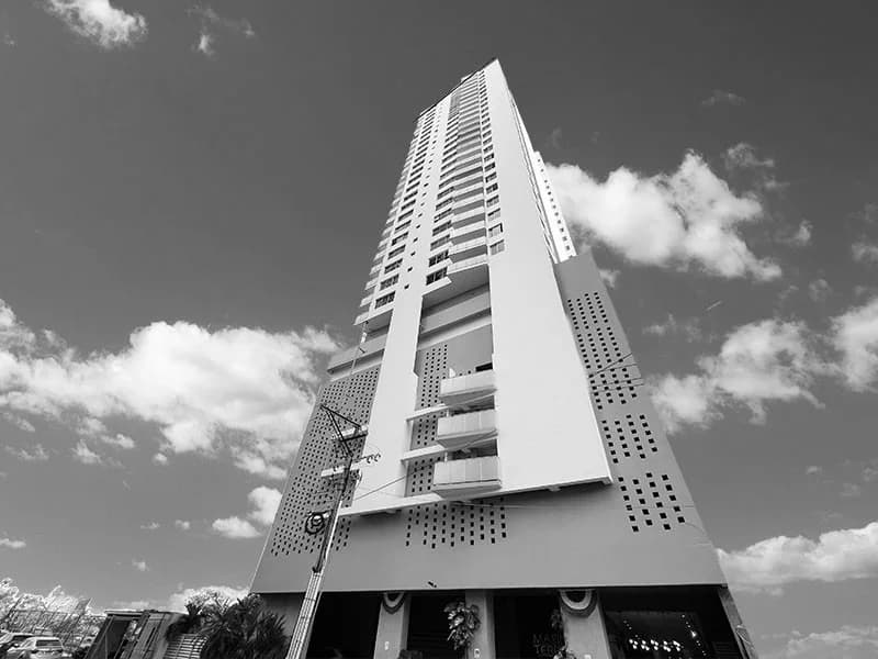Black-and-white upward view of the Marina Terrace residential tower, Bella Vista, Panama City