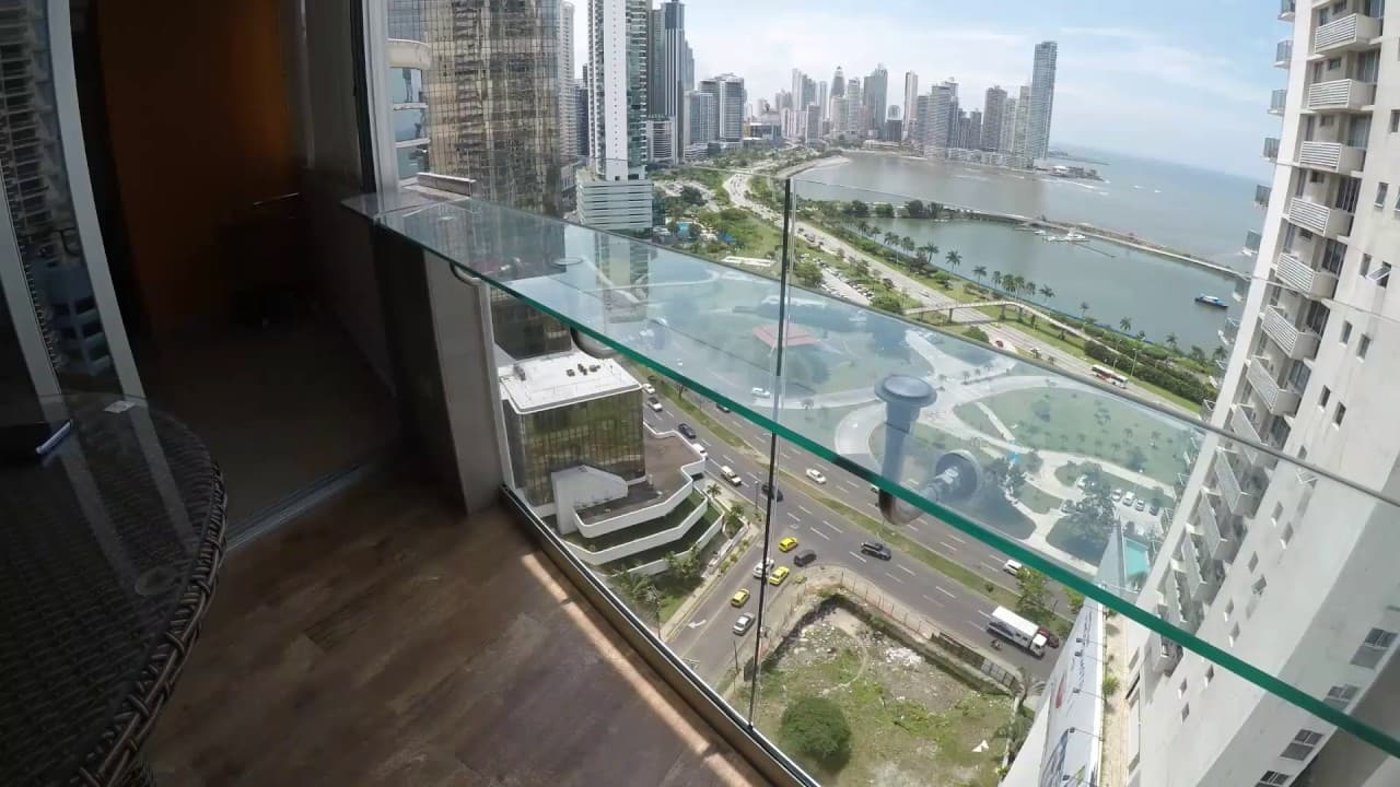 Balcony with glass railing at Marina Terrace overlooking the Cinta Costera, Avenida Balboa and the Panama City skyline