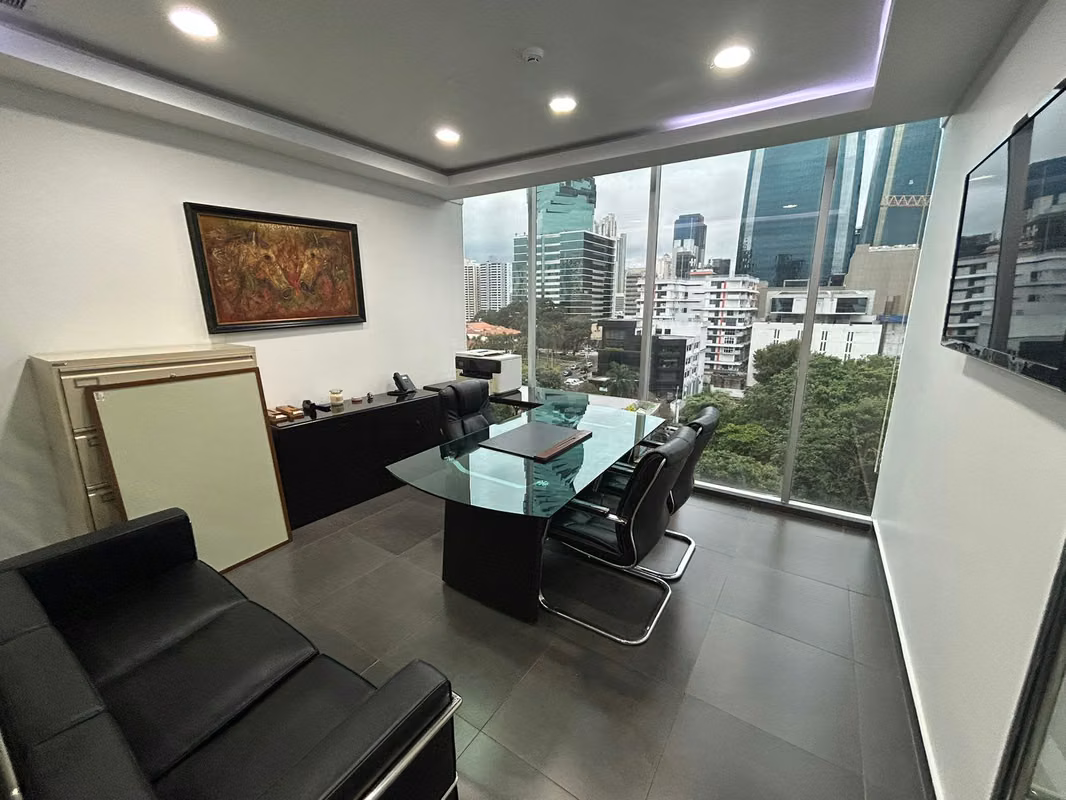 Executive office with floor-to-ceiling windows and views of the Obarrio towers in Office One Tower, Panama City