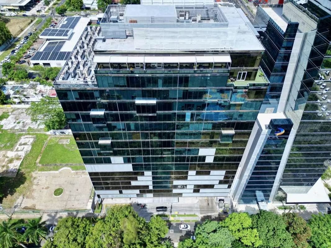 Aerial view of the Office One Tower glass office building with its white panel pattern, Obarrio, Panama City