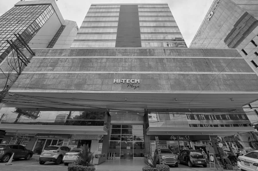 Black-and-white view of the High Tech Plaza building facade and entrance, Obarrio, Panama City