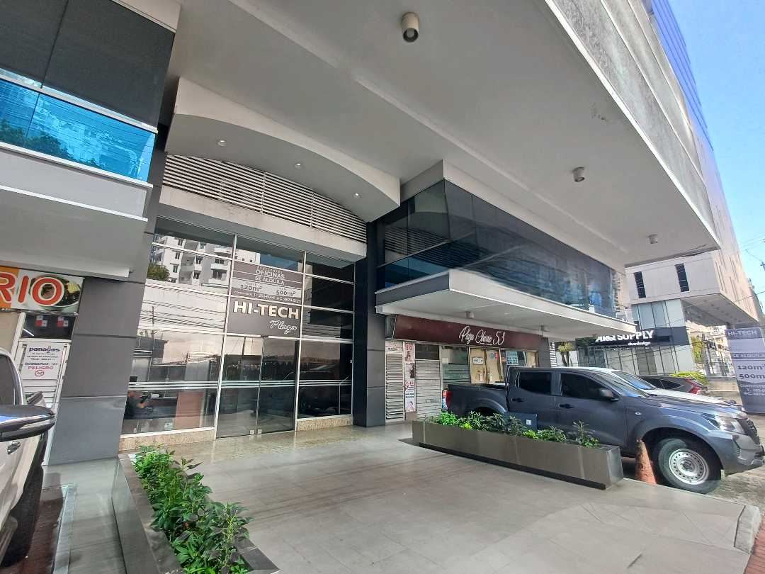 Ground-floor entrance and drop-off of the Hi-Tech Plaza building with its name sign, Obarrio, Panama City