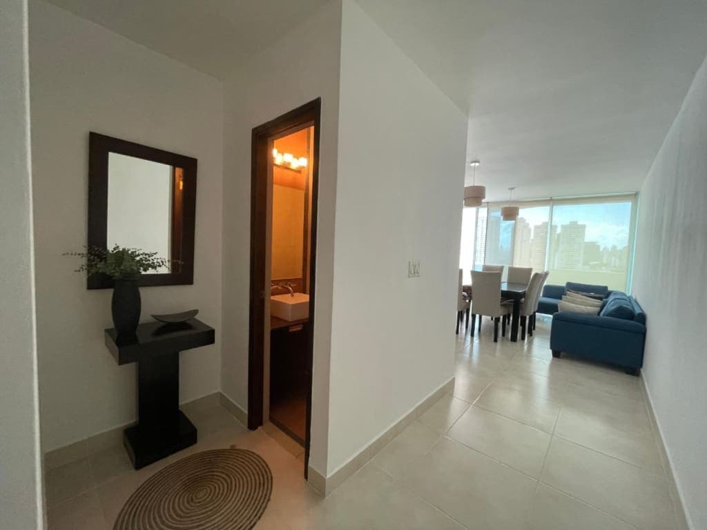 Entry hall leading to the living and dining area of an apartment at PH Infinity, San Francisco, Panama City