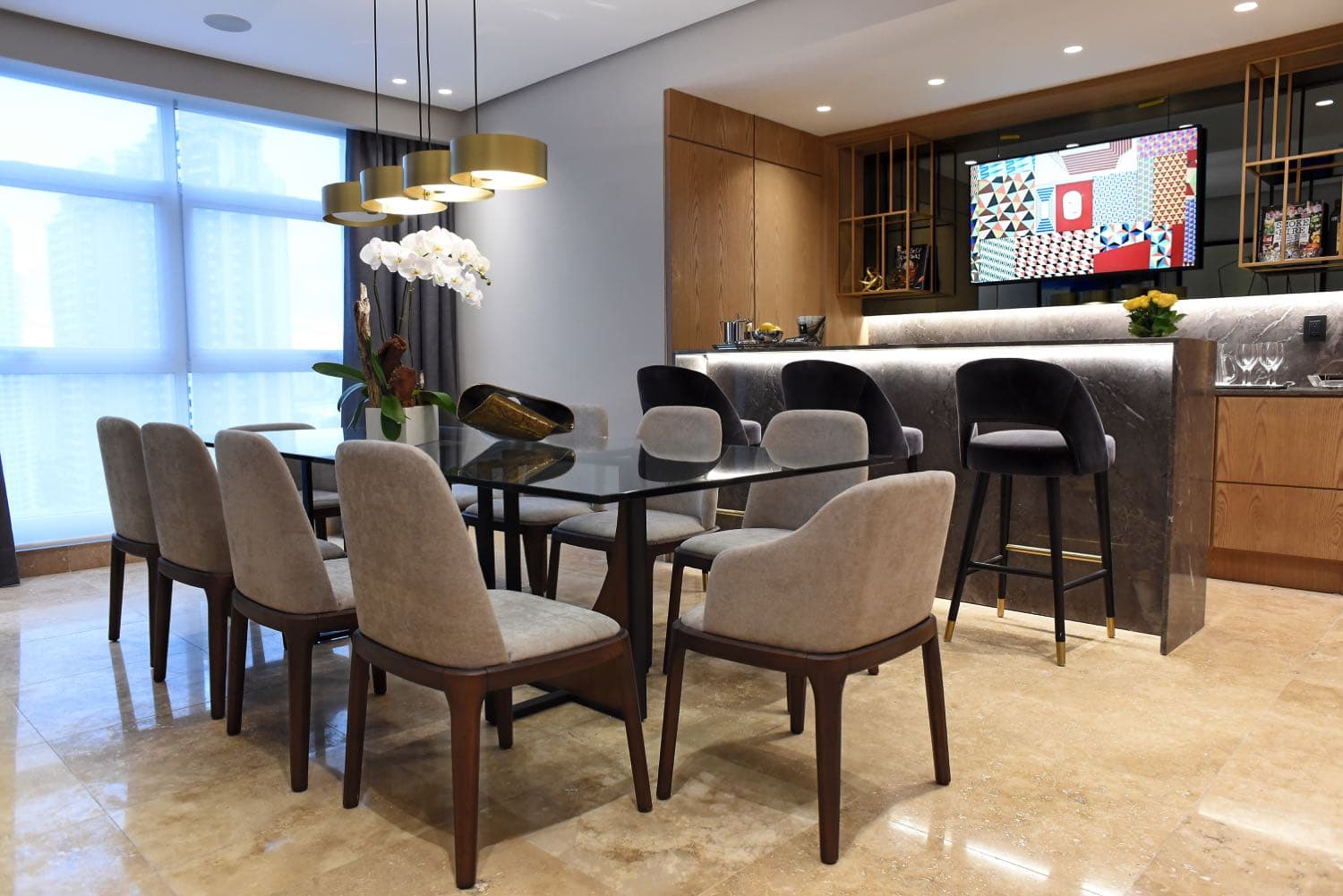 Dining area and bar counter in a furnished Q Tower apartment