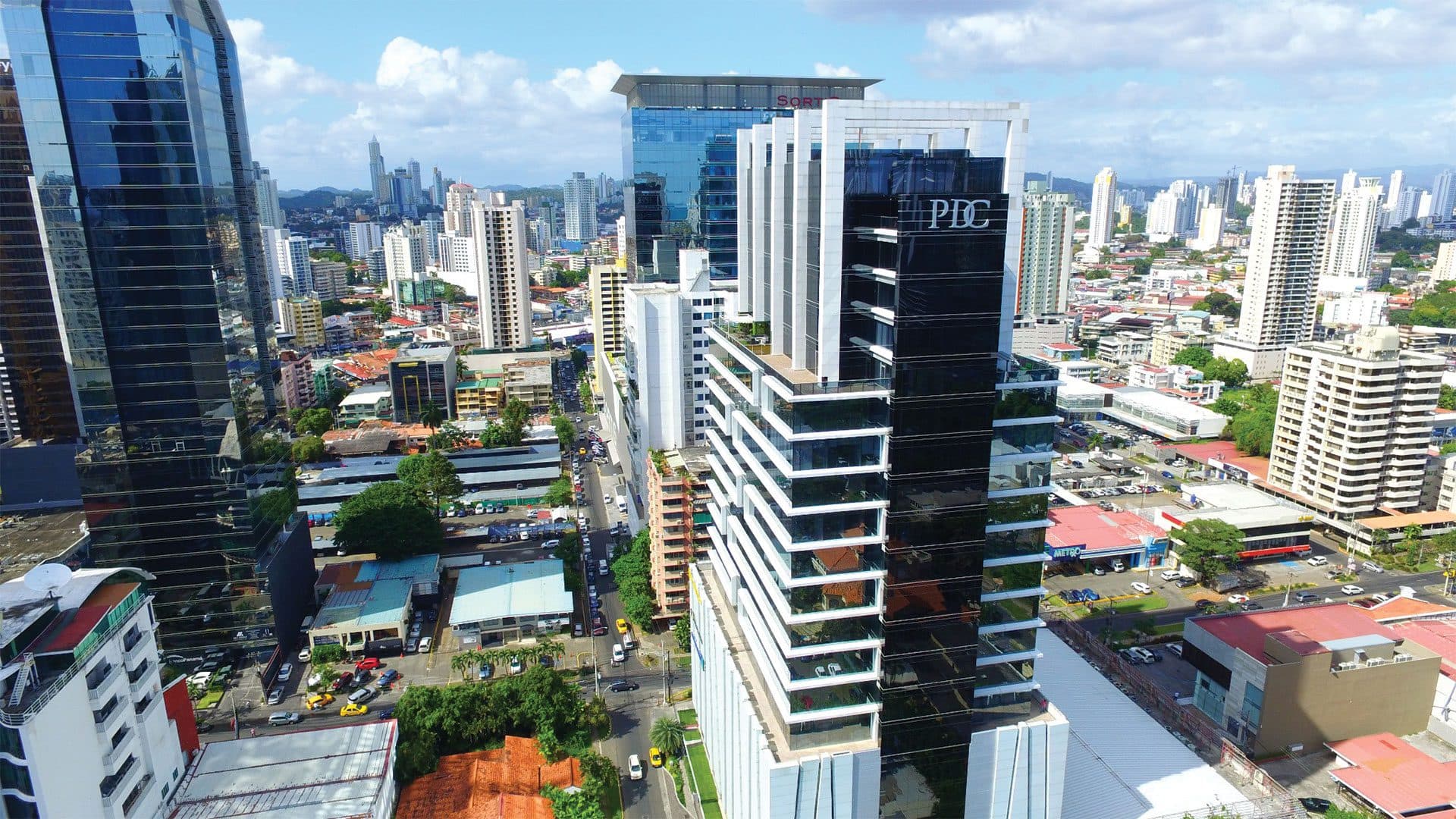Aerial view of the PDC Panama Design Center tower in Obarrio with the city beyond