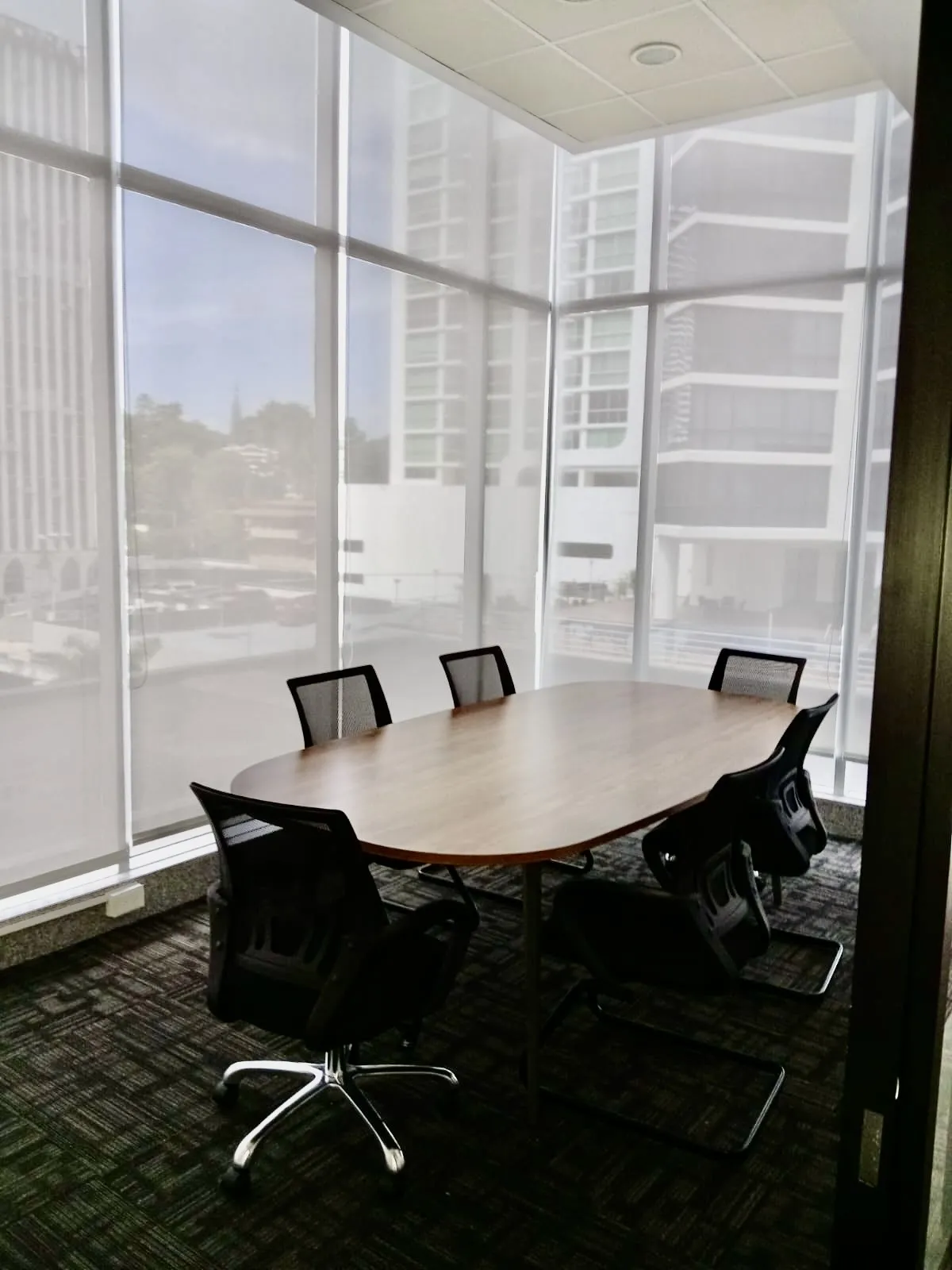 Glass-walled conference room in an office at Habitats Plaza, Marbella, Panama City