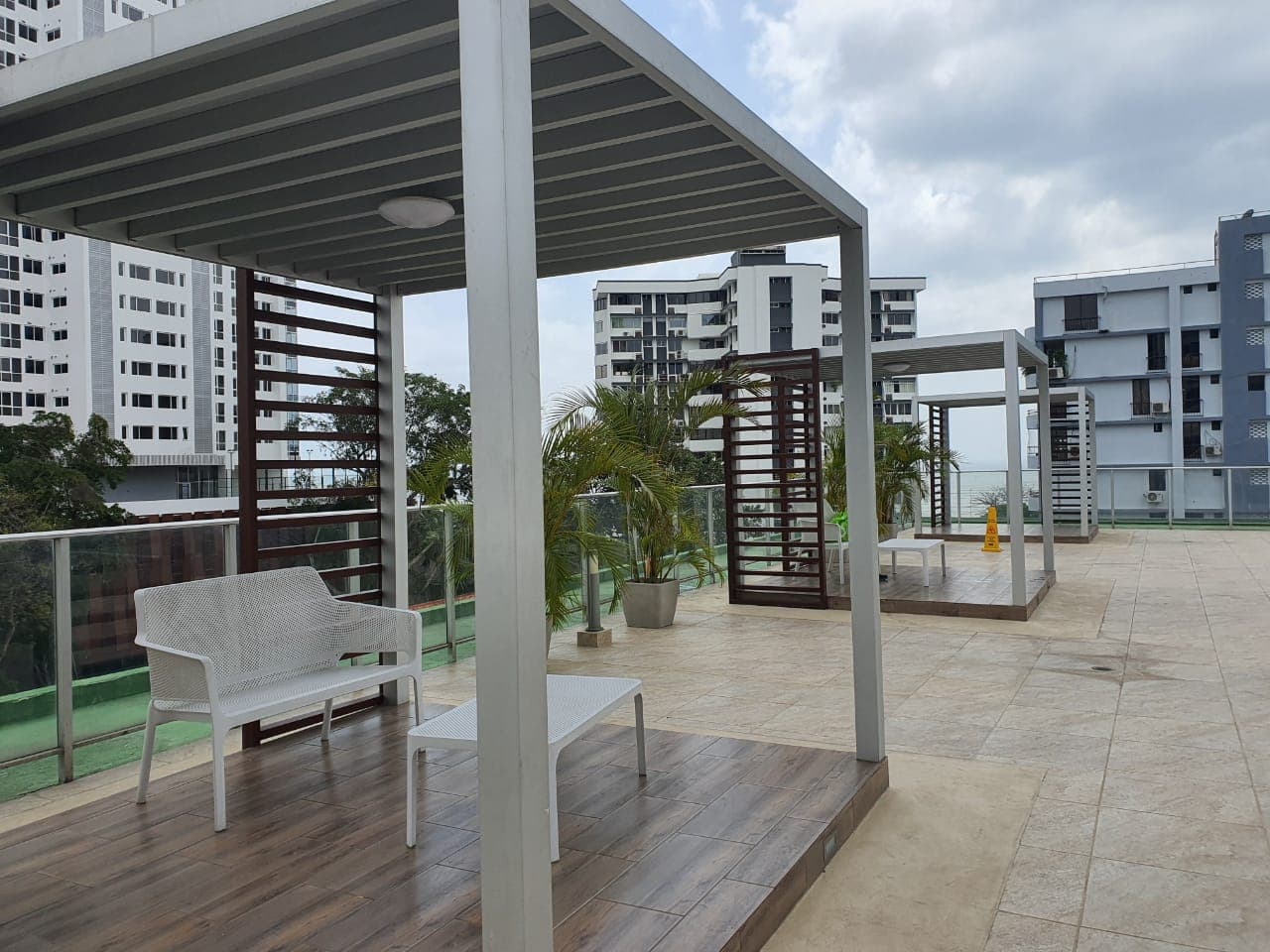 Rooftop social terrace with pergolas and lounge seating at PH Le Mare, Coco del Mar, Panama City