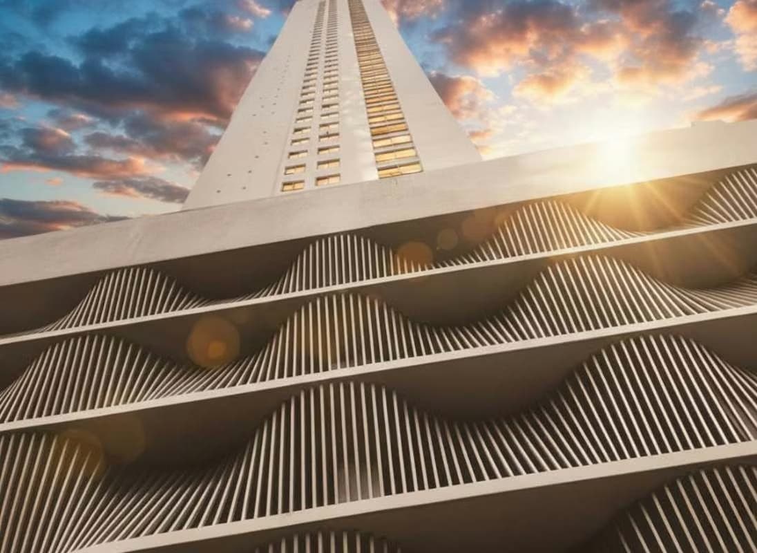 PH Le Mare residential tower rising above its podium of wave-shaped white fins at sunset, Coco del Mar, Panama City
