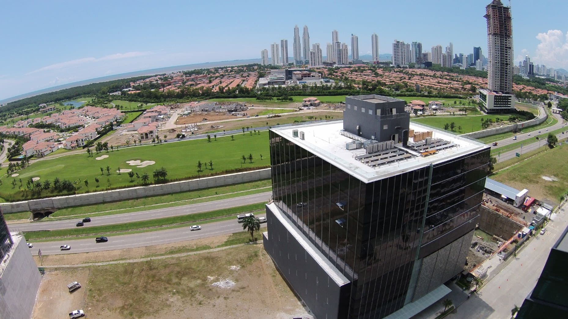 Aerial view of PH Arifa beside the Corredor Sur with the Panama City skyline behind