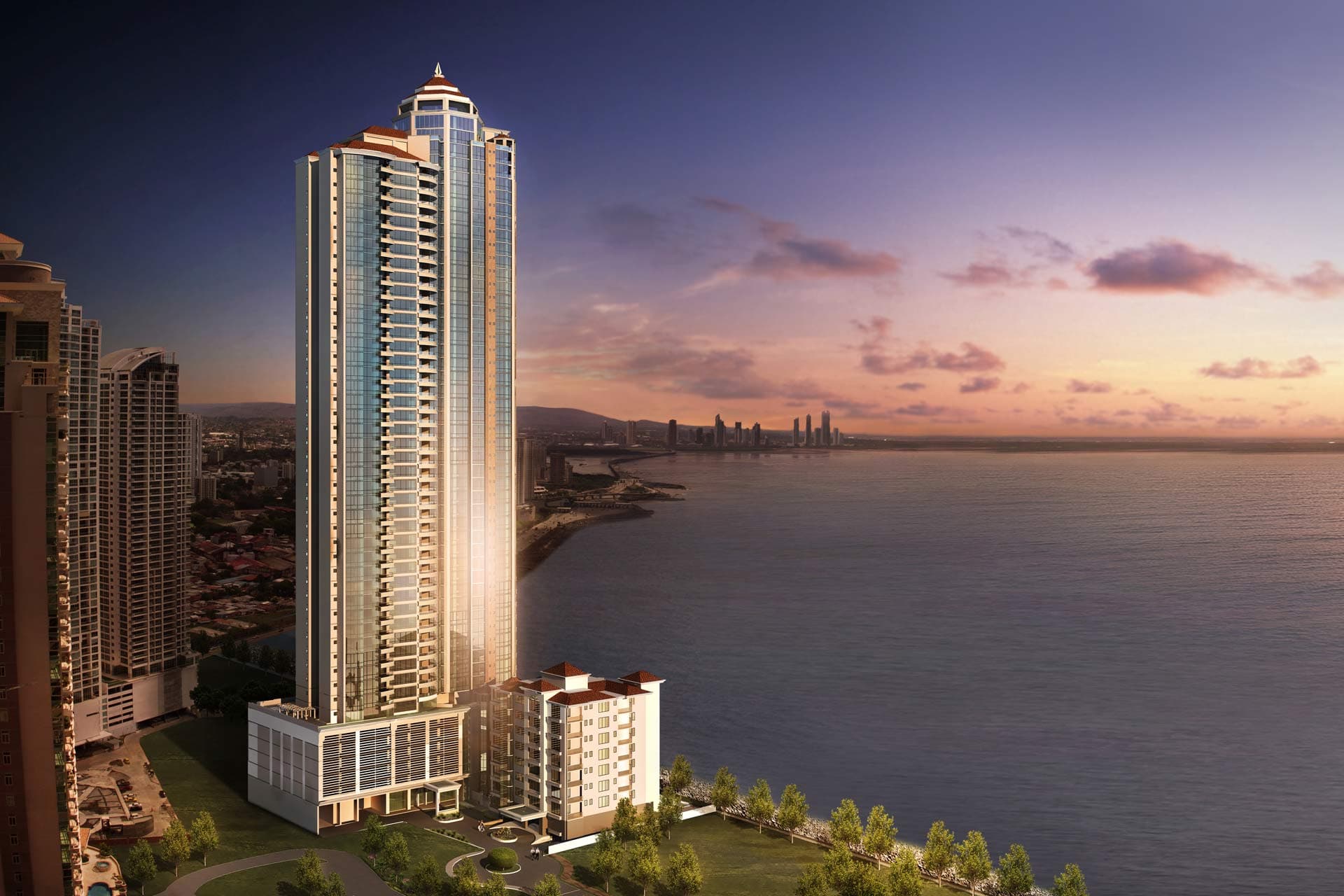 Pacific Point Torre 400 on the Punta Pacifica waterfront at dusk with the Panama City coastline behind