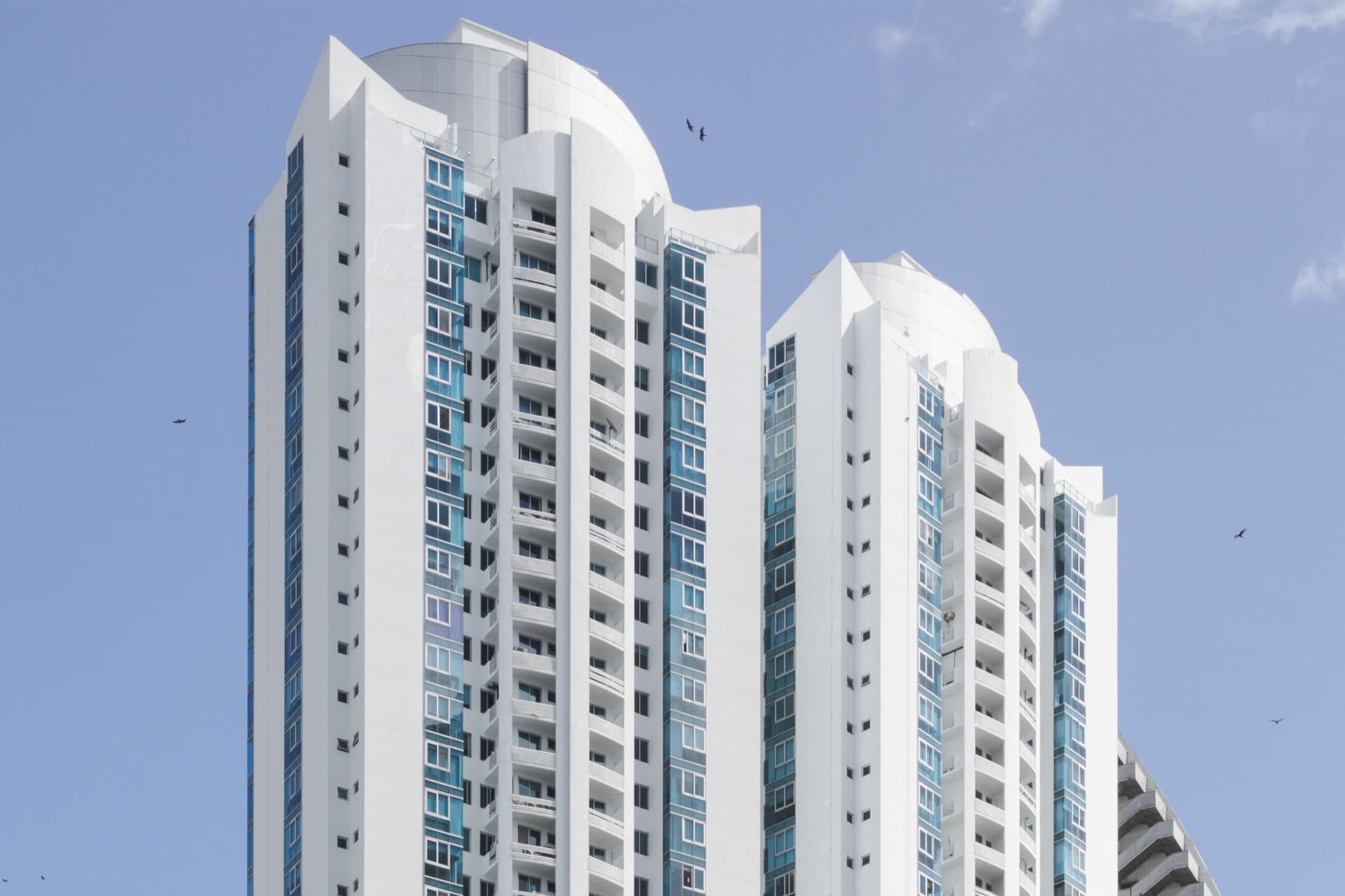 White residential towers of Pacific Village against a clear sky in Punta Pacifica