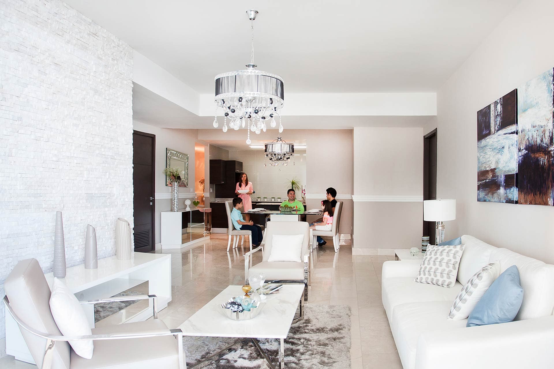 Living and dining room with white furnishings in a Grand Tower apartment