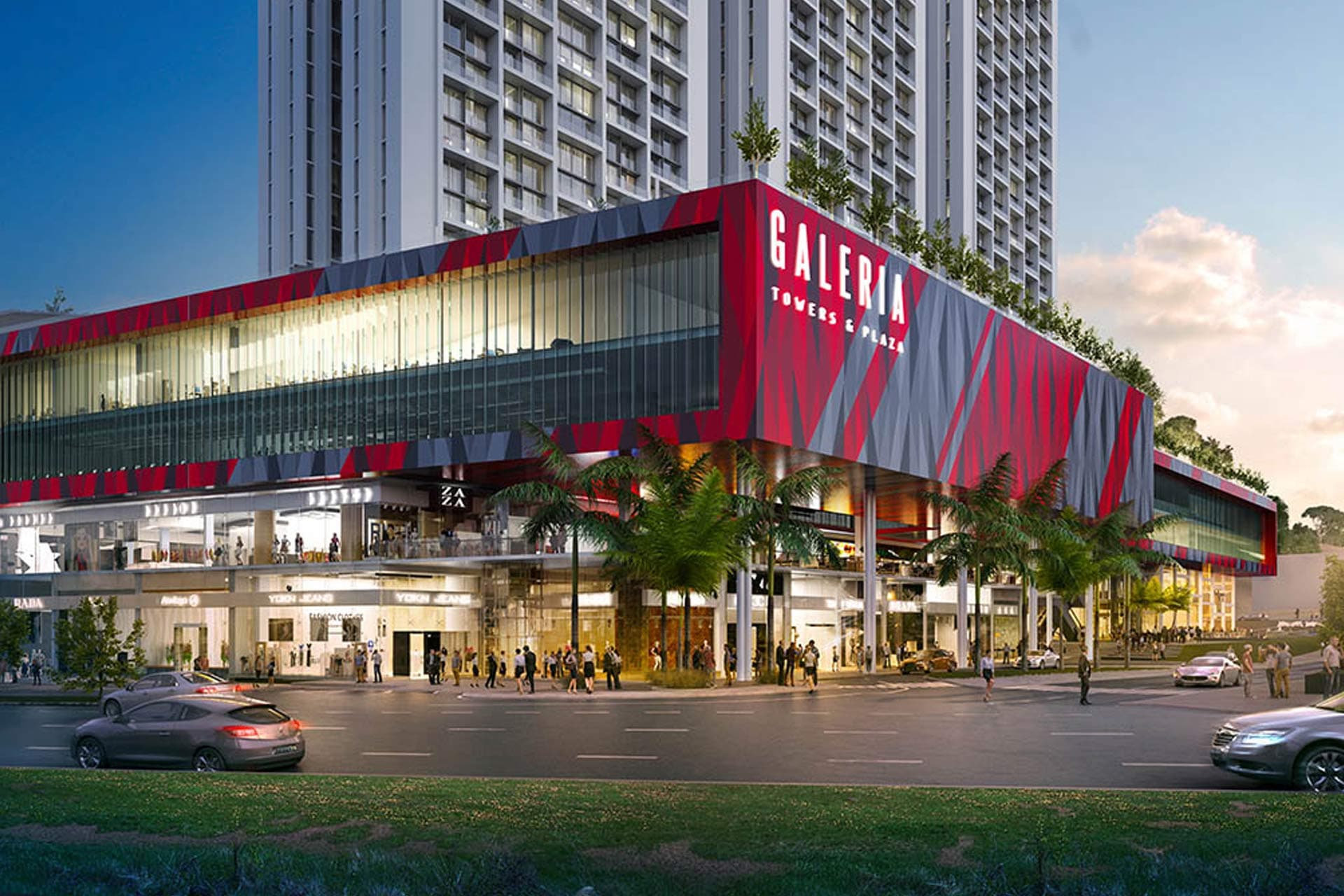 Galería Towers & Plaza podium facade with Emmanuel Moses artwork and storefronts at night