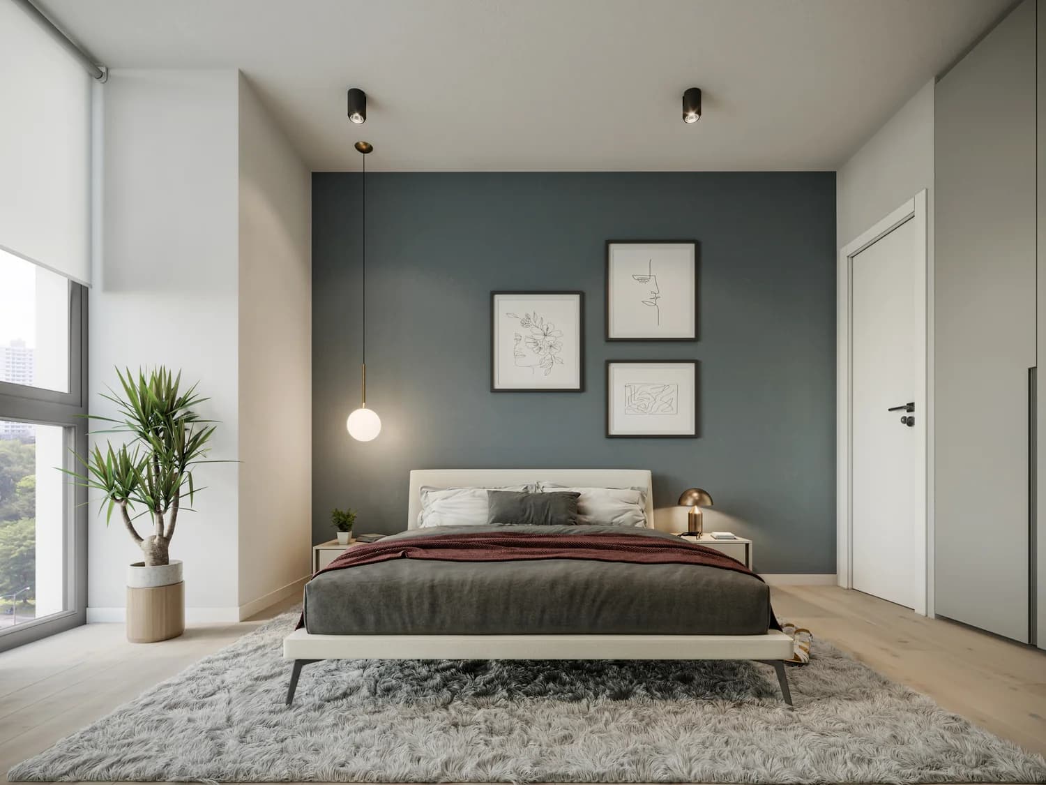 Bedroom with teal accent wall in a Galería Towers apartment