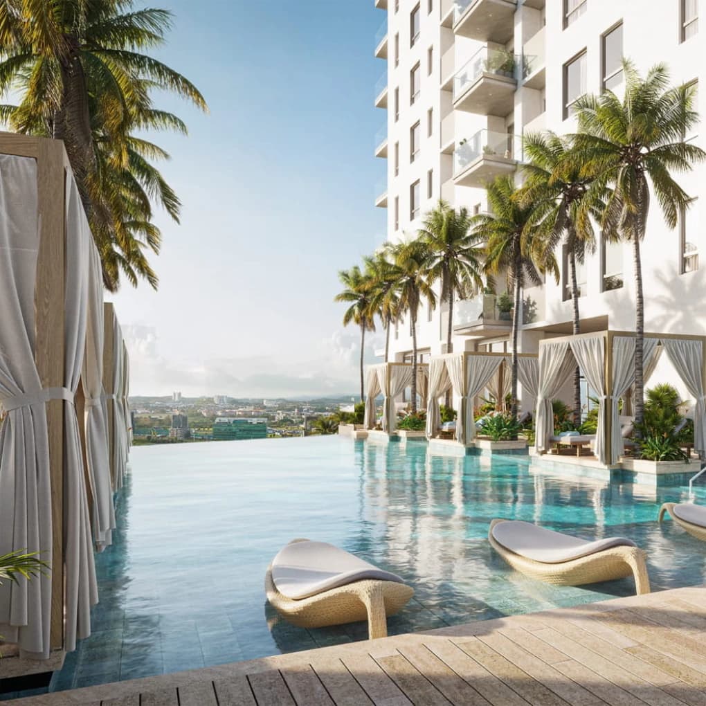 Infinity pool with in-water loungers overlooking Santa Maria at Corotú