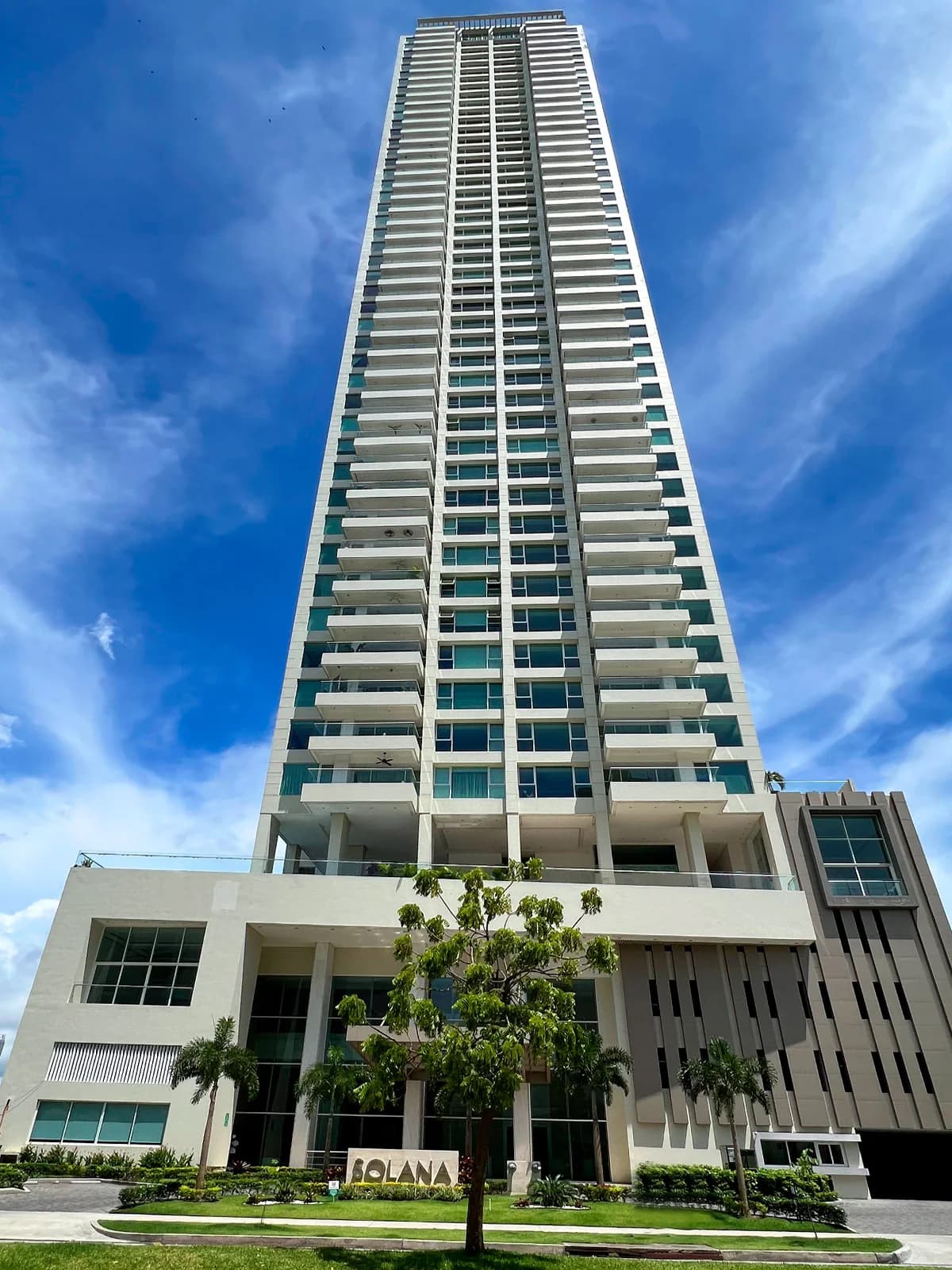 Solana residential tower in Santa Maria Golf & Country Club against a blue sky