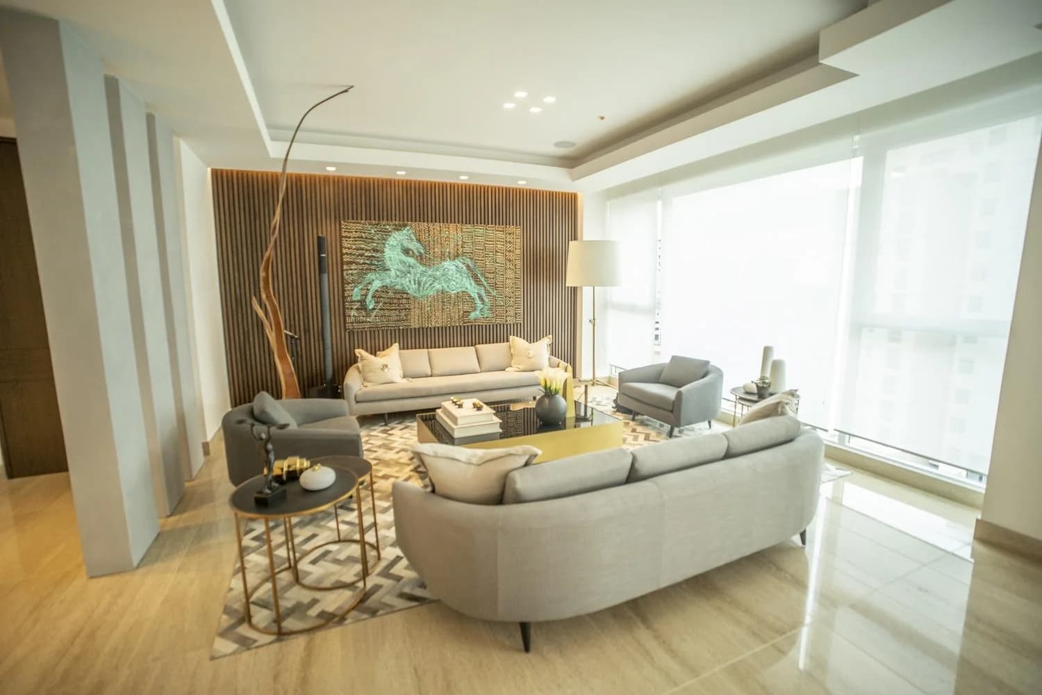 Living room with marble floors and full-height windows in a Solana apartment