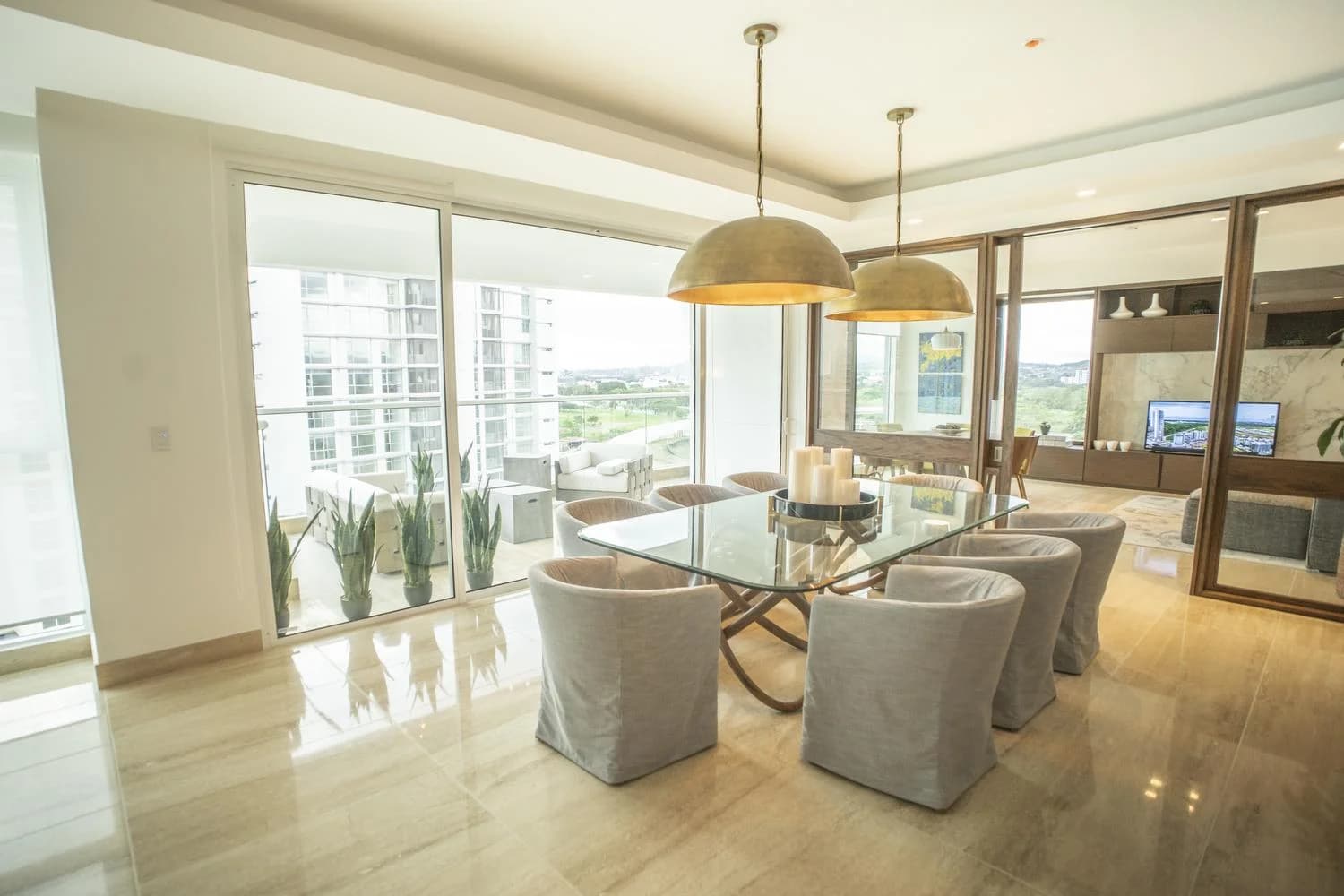 Dining area with sliding doors to the balcony in a Solana apartment