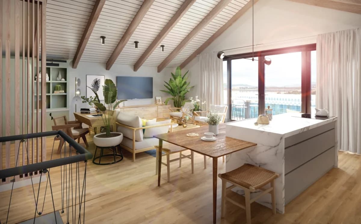 Vaulted living and dining area with ocean view in the Plaza Novena west penthouse