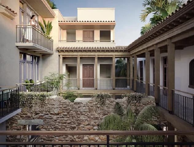 Rendering of the Patio San Miguel central courtyard with colonial stone ruins and surrounding galleries