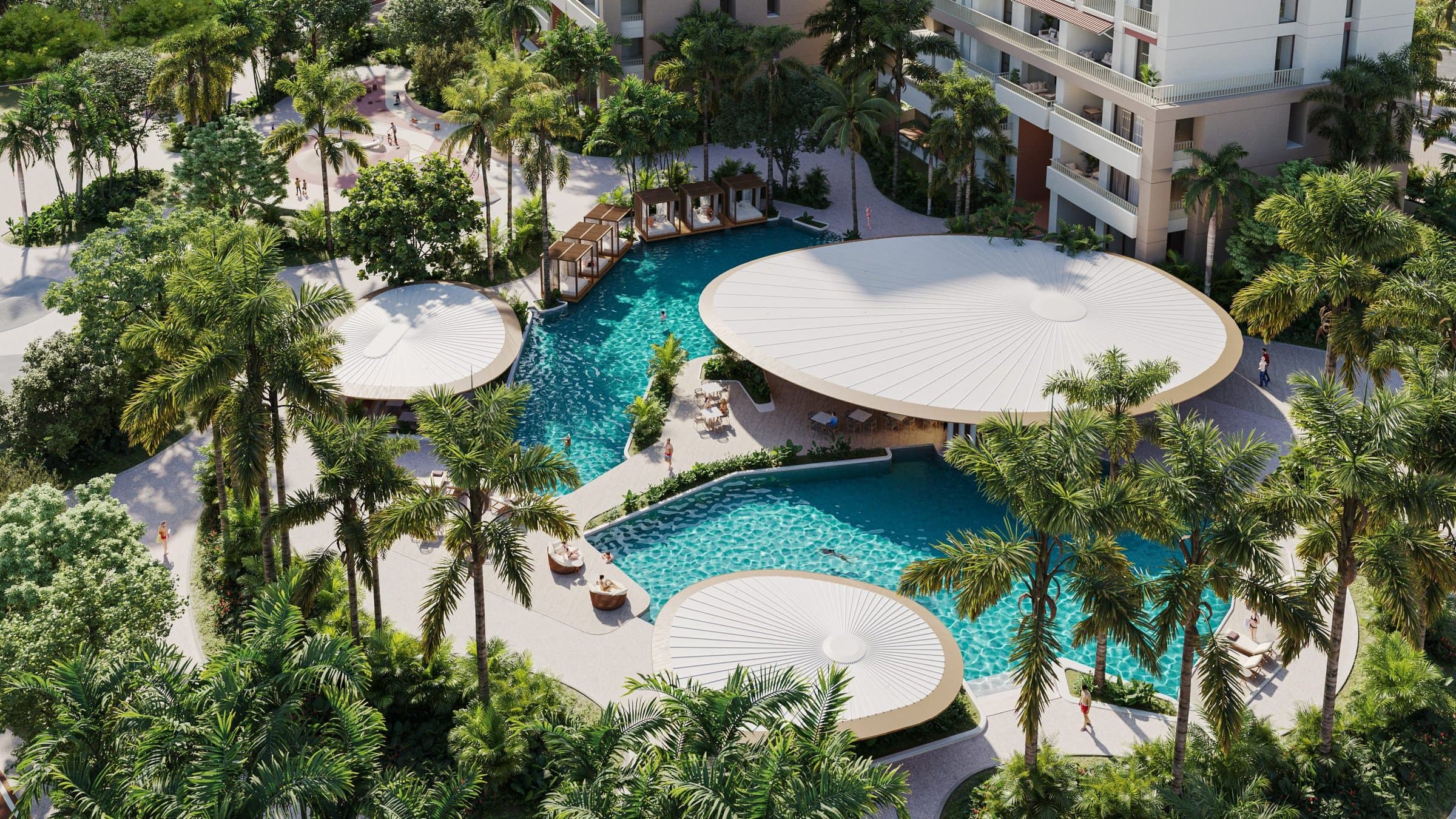 Aerial view of the lagoon pools with circular shade decks at Alamar