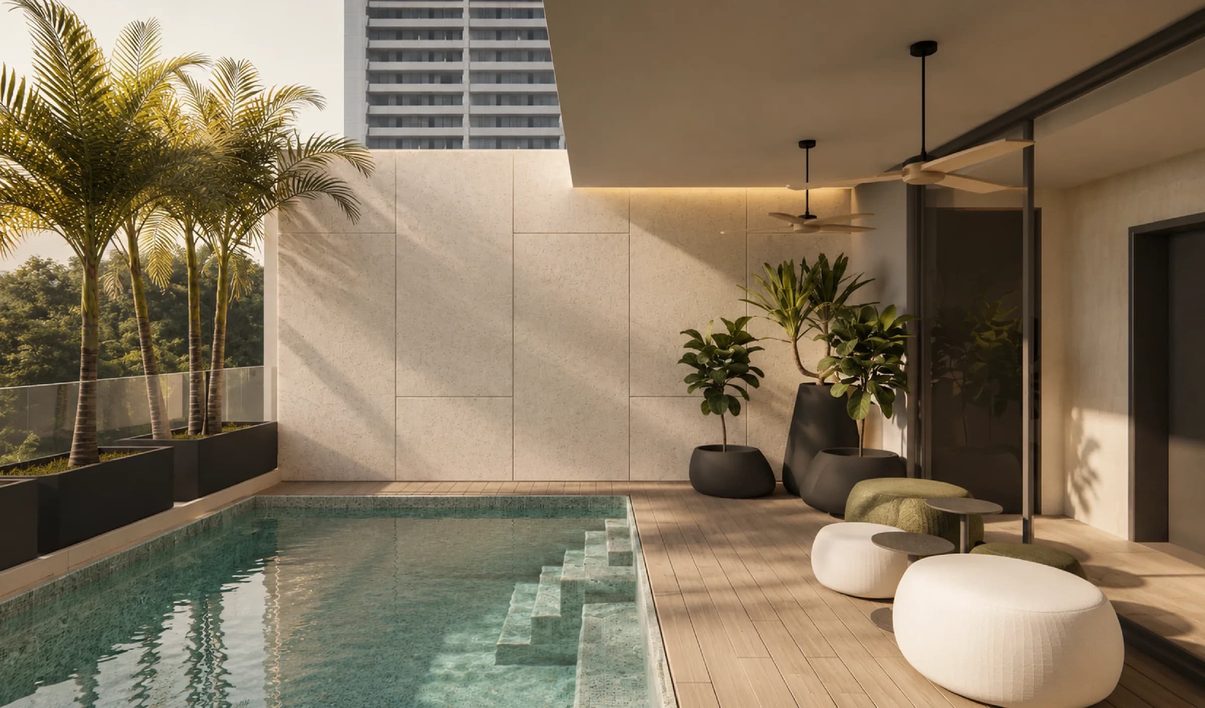 Pool terrace with palm trees and lounge seating at The Edge Marbella