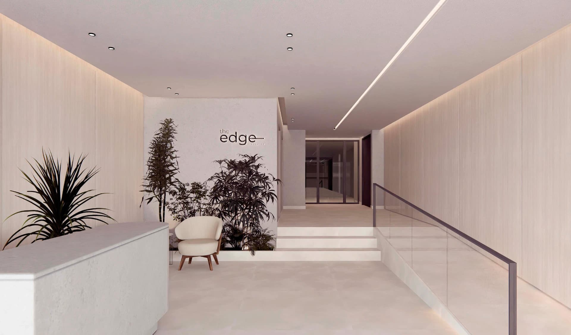 Lobby with The Edge sign and reception desk at The Edge Marbella