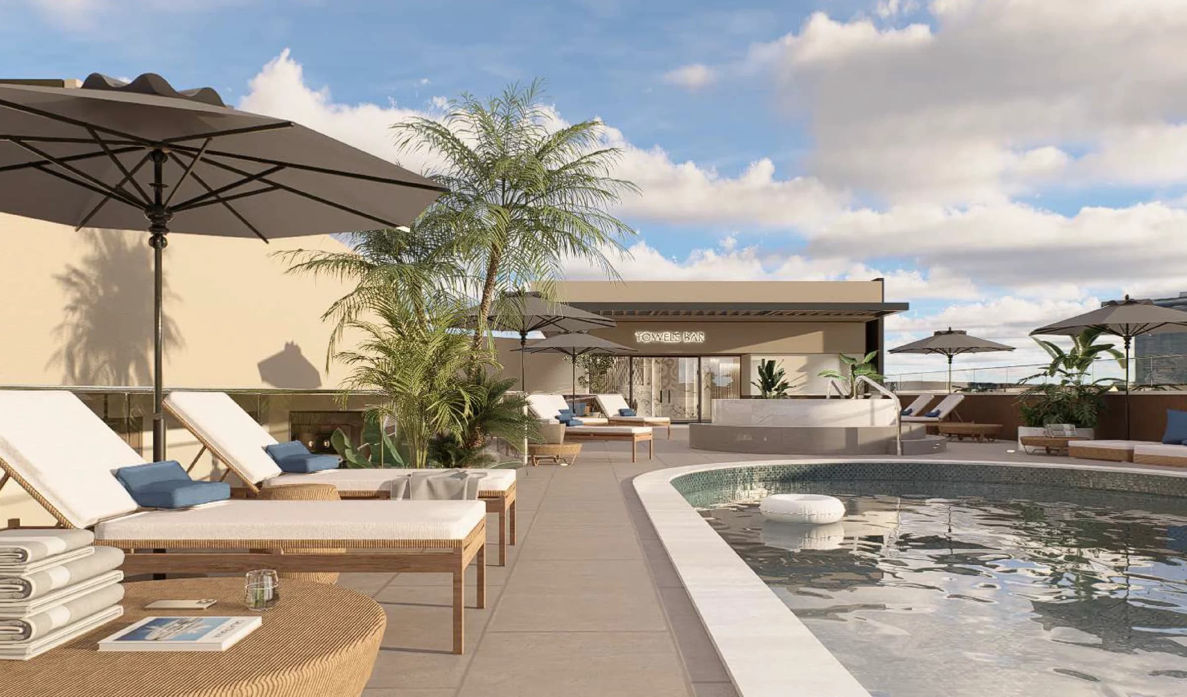 Rooftop pool deck with umbrellas and daybeds at Stay Bella Vista