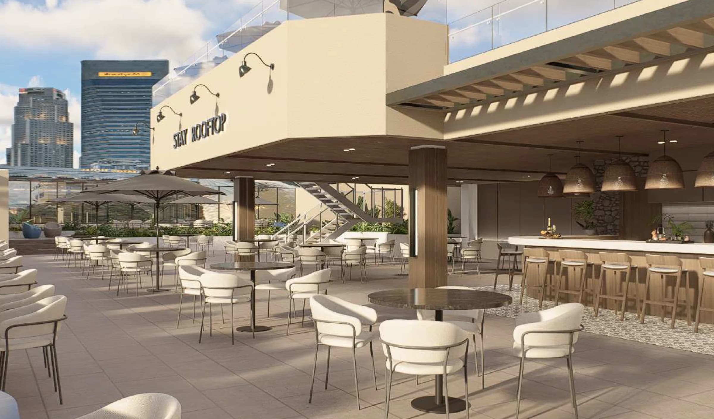 Sky bar terrace with dining tables and city views at Stay Bella Vista
