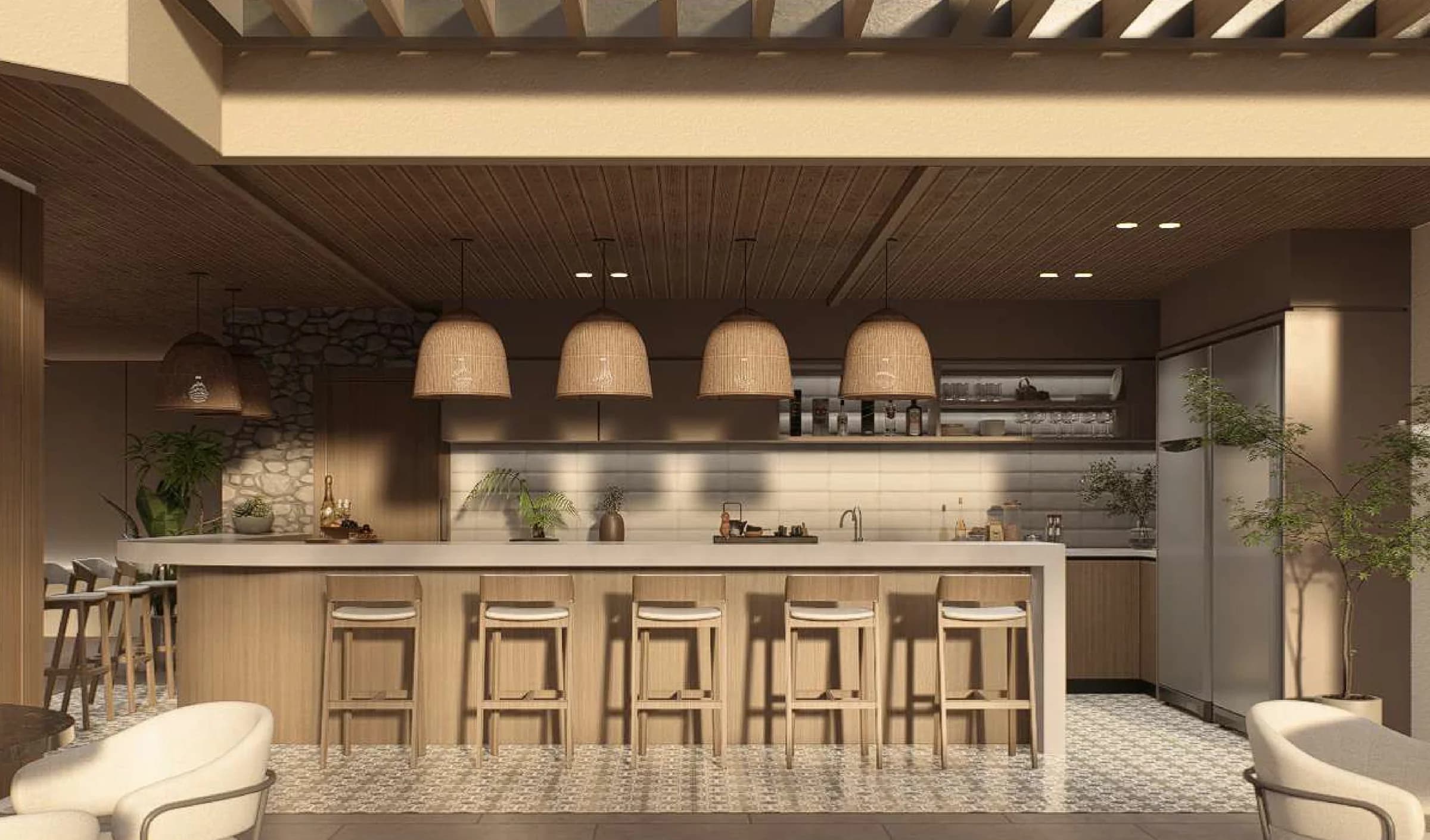 Indoor bar counter with pendant lights and stools at Stay Bella Vista