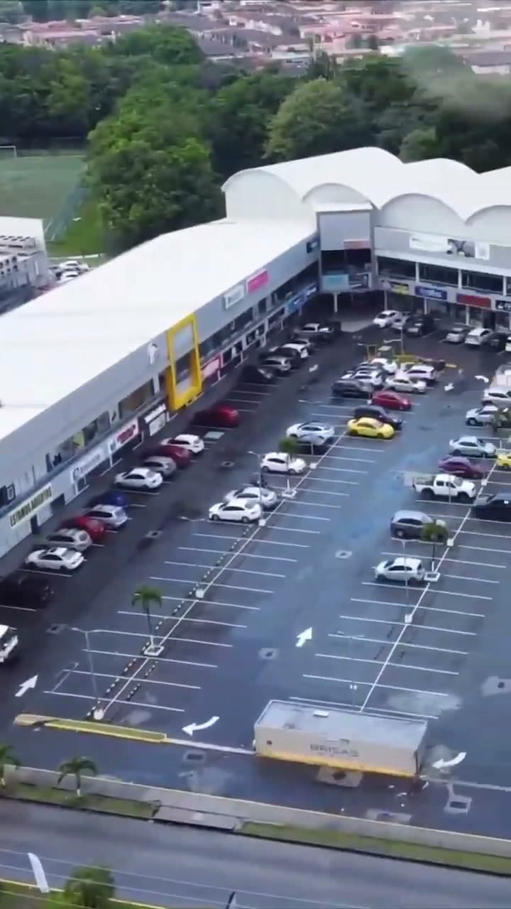 Aerial view of Brisas Mall and its parking lot in Brisas del Golf, Panama City
