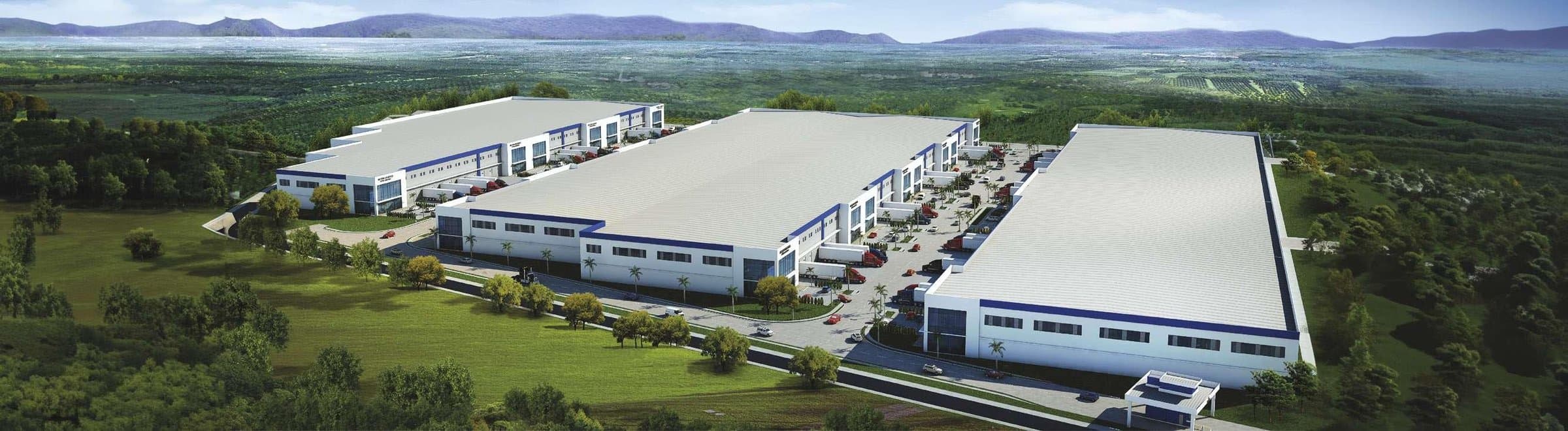 Front of the first warehouse at Parque Logístico Cocosolito with its loading docks and blue band, Colón Free Zone